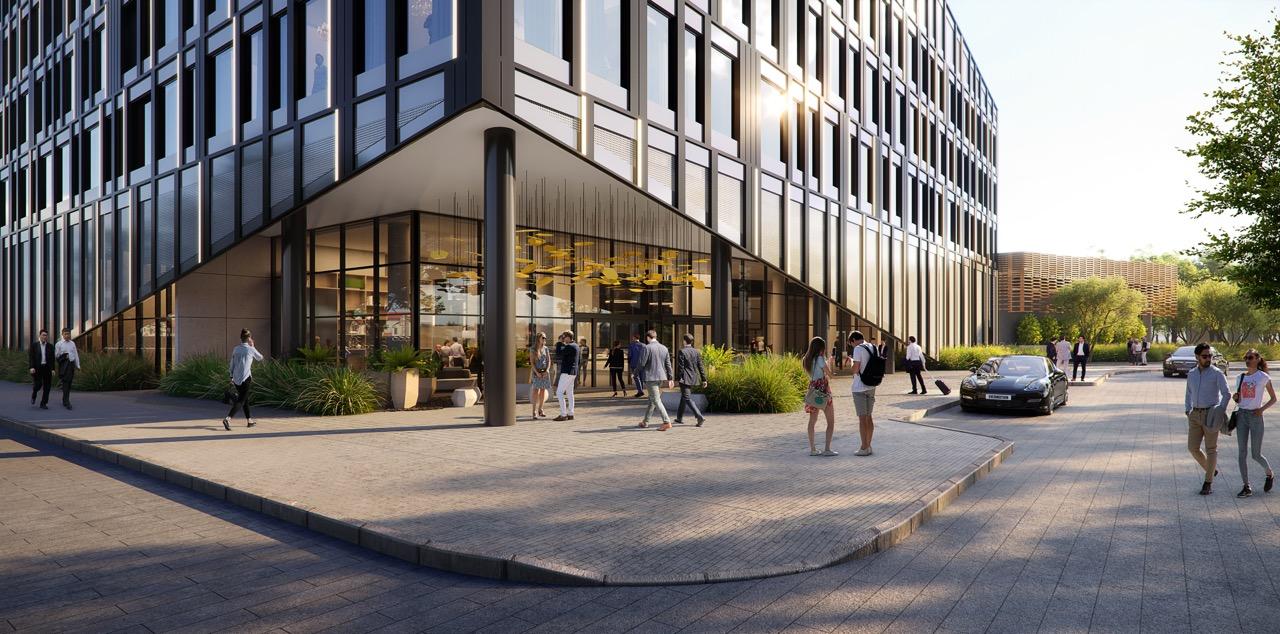 Modern office building exterior with glass windows, people walking on the sidewalk, a parked car, and greenery around. Sunny day.